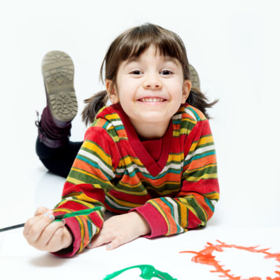Little painter girl. Four years old girl painting.